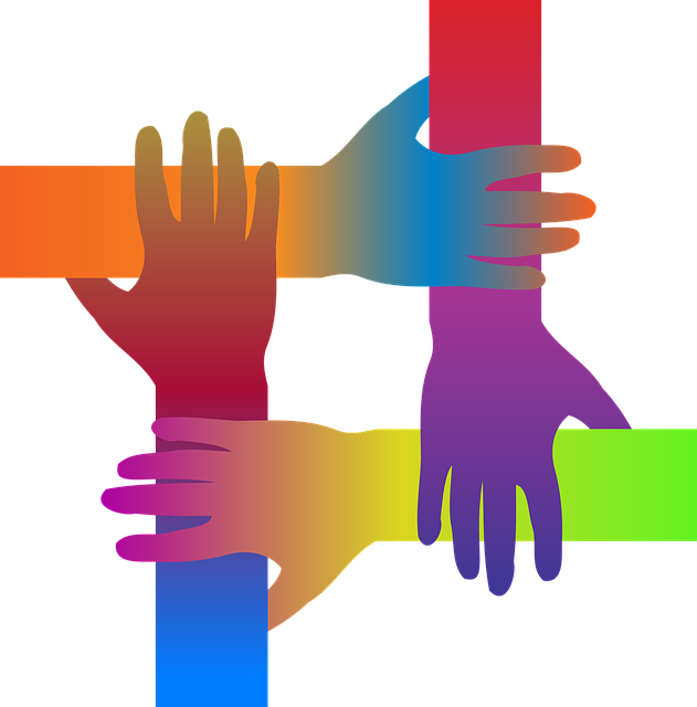 Four interlocking hands in different colors